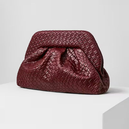 Burgundy woven textured clutch bag with golden buckle closure"